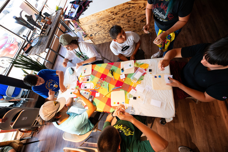 Overhead shot of students at a table beading