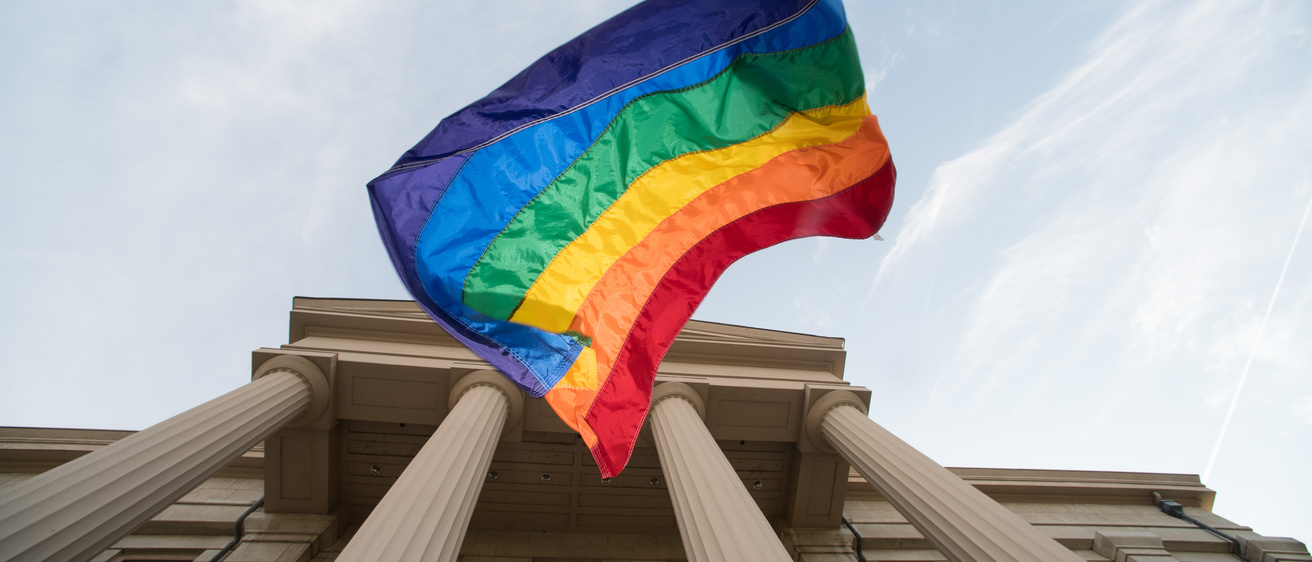 Pride Flag falling from the Old Capitol